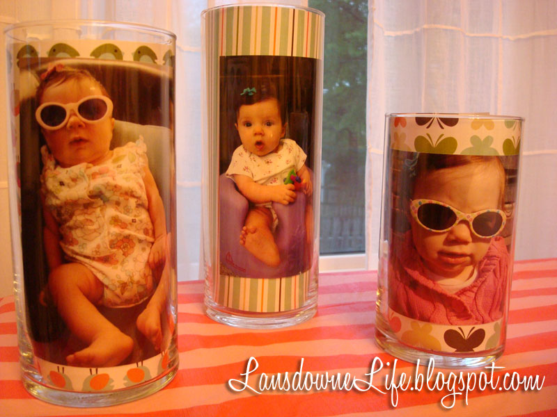 Photos displayed in glass cylinders