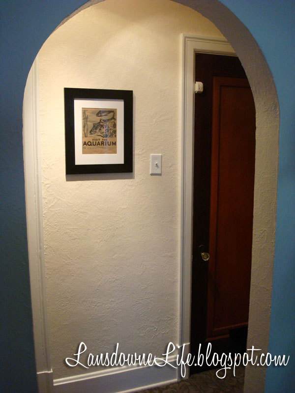 Hallway makeover with new carpet, paint, and artwork