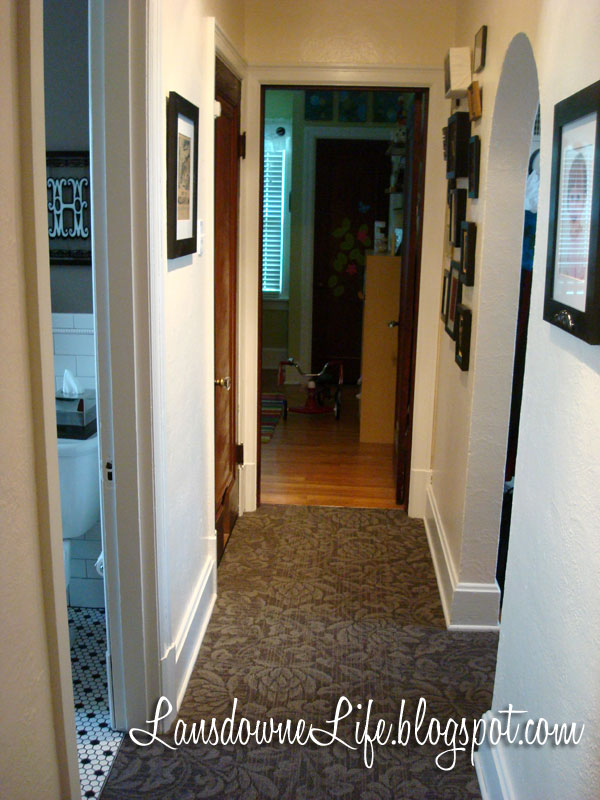 Hallway makeover with new carpet, paint, and artwork