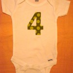 Baby gifts: Month onesies and decoupaged frame