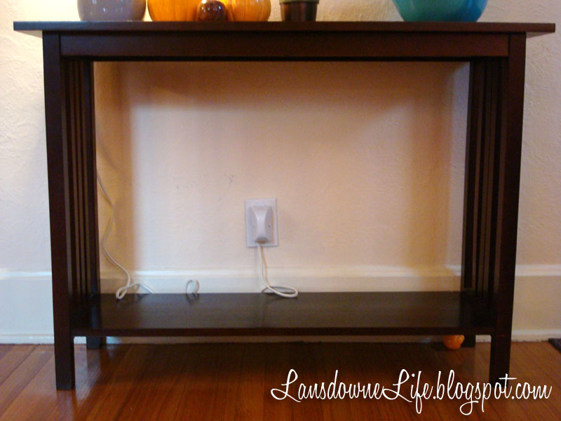 Using an open console table for book storage
