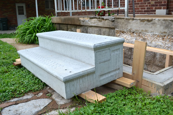 Installing pre-made concrete porch stairs