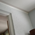 Paint splotches on the ceiling? Hide them with a border.