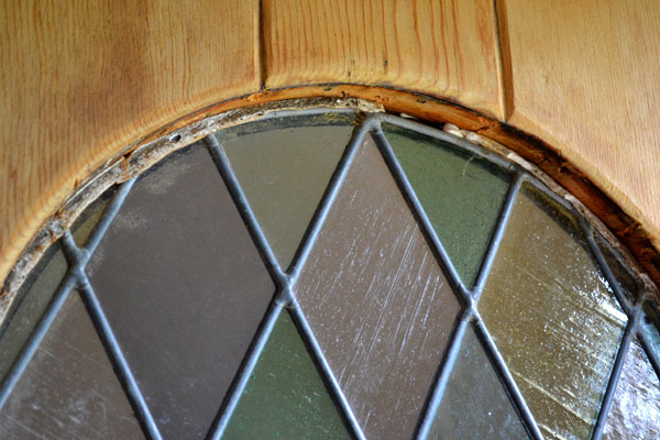 Rotted trim around stained glass on front door