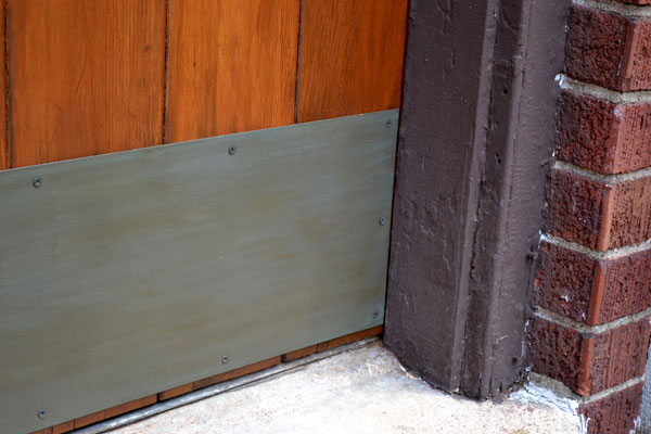 Faux painted brass patina on door kickplate