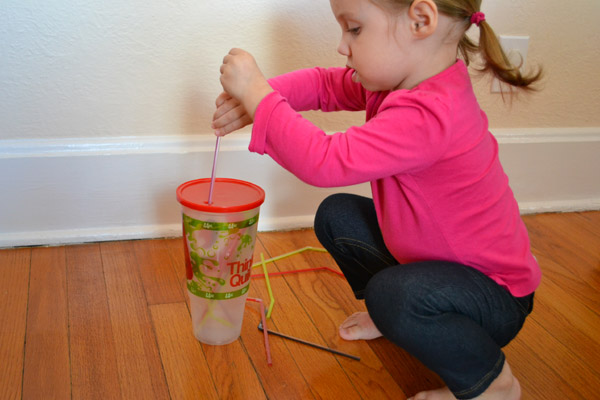 Putting straws in a cup