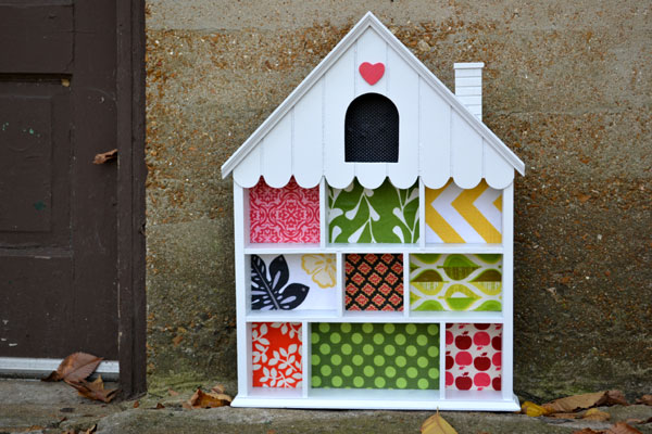 House shelf turned toddler dollhouse