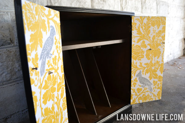 Repainted record cabinet with decoupaged fabric inside