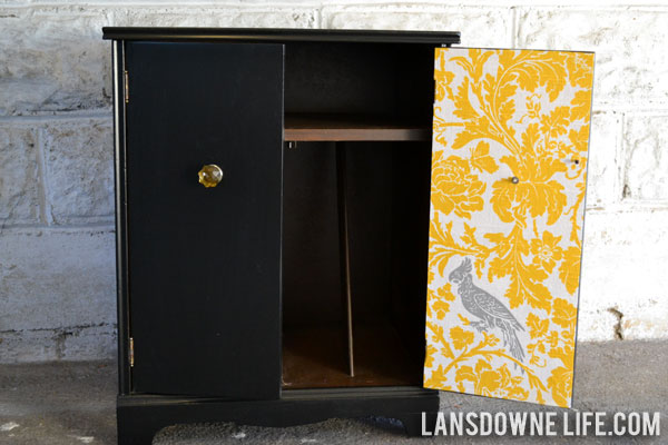 Repainted record cabinet with decoupaged fabric inside