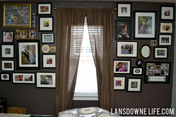Bedroom family photo gallery wall