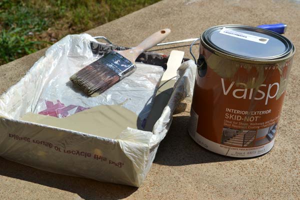 Use a plastic bag as a paint tray liner