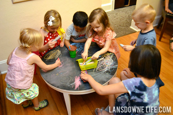 Birthday party activity drawing with chalk