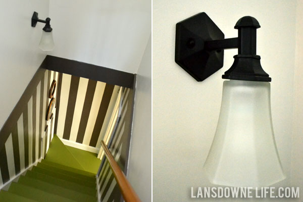 Stairway makeover reveal with green painted stairs and black and white wall stripes
