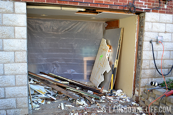 Replacing an old garage door with a wall