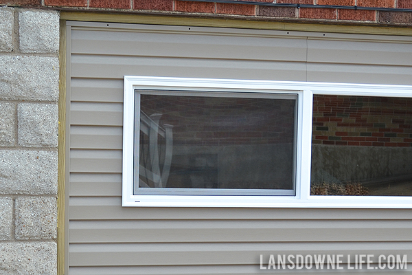 Replacing an old garage door with a wall