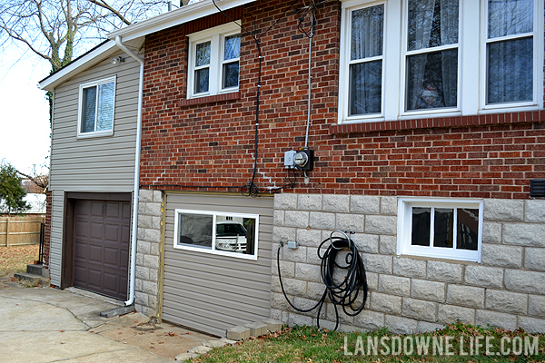 Replacing an old garage door with a wall