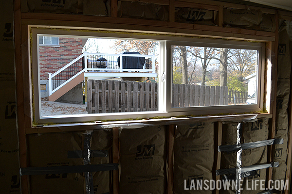 Replacing an old garage door with a wall