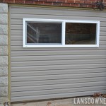Replacing an old garage door with a wall