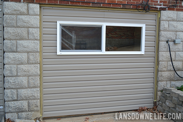 Replacing an old garage door with a wall