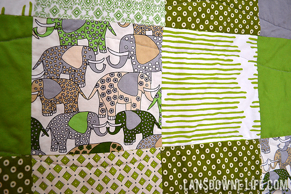 Green patchwork squares baby quilt