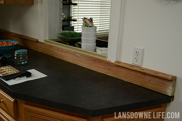 Painted wood molding kitchen backsplash