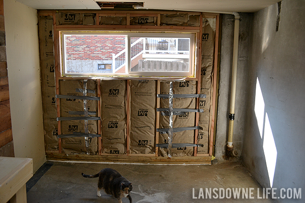 Replacing an old garage door with a wall