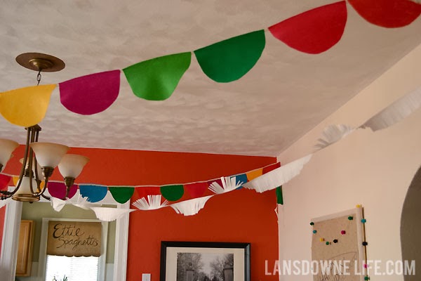 Colorful scalloped felt and paper fringe birthday party banners