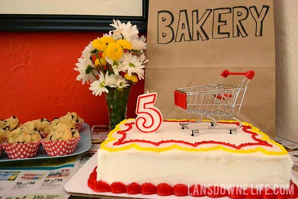 Grocery store birthday party cake with shopping cart