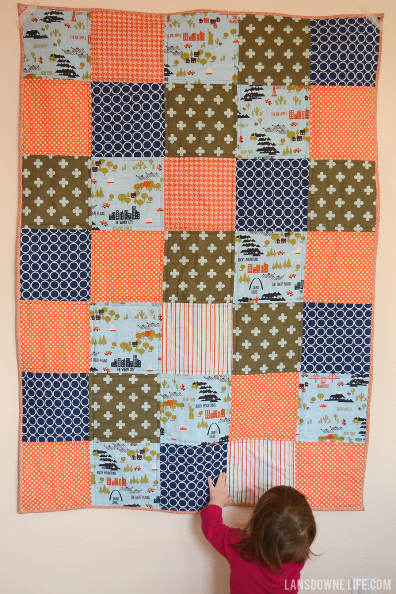 Orange, navy, and olive patchwork baby quilt