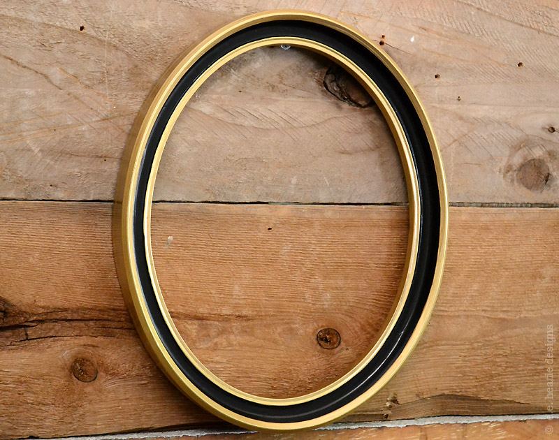 Gold and black oval frame