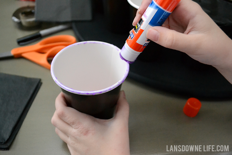 Use a glue stick on the top of the cup
